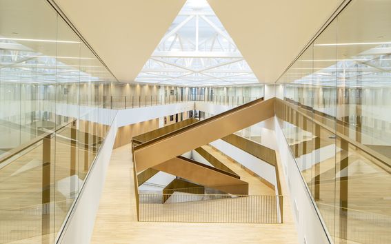 Aalto University Business School atrium, light wood, glass and staircases